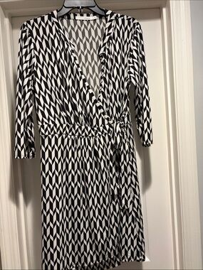 Black faux wrap and White Geometric Wrap Midi Dress